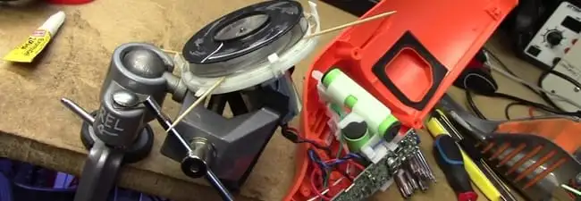 Vacuum cleaner repair parts and tools on a workbench in Springfield, MO