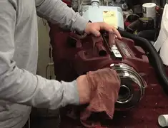 Vacuum repair technician cleaning and servicing a vacuum motor in Springfield, MO